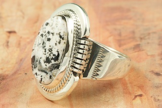 White Buffalo Turquoise set in Sterling Silver Ring. This Beautiful Stone is formed from the minerals Calcite and Iron. It is mined near Tonopah Nevada. Created by Navajo Artist John Nelson. Signed.